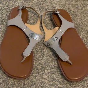 Gray Michael Kors sandals.
